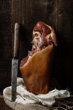 Pork knuckle and knife.