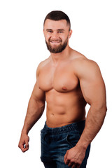 Portrait of a strong bearded male fitness model, torso.