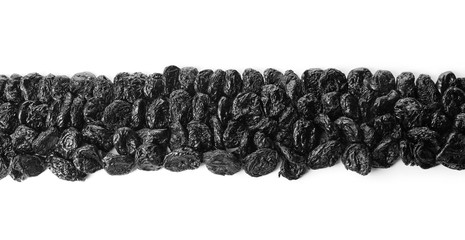 Tasty dried plums on white background