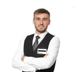Male hotel receptionist in uniform on white background
