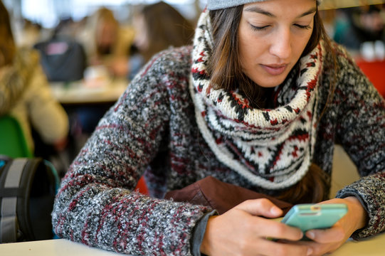 Young woman looking her phone