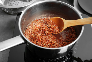 Stirring rice in saucepan
