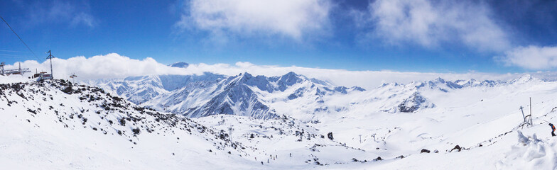 Fototapeta na wymiar Snowy mountain landscape at the height of caucasus mountains