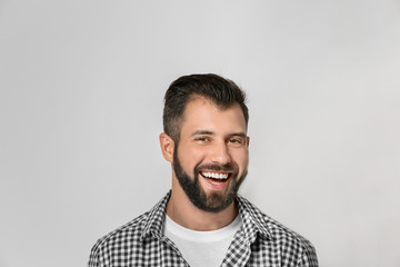 Obraz premium Handsome man on light background