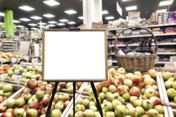 Fruit department in the supermarket. Defocused image. Place for your text, white background.