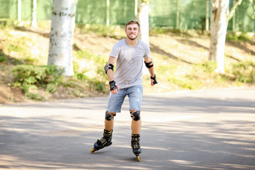 Young man rollerskating in park