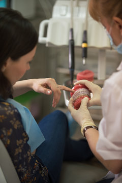 Dentist explaining something to a patient
