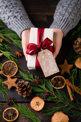 Woman hands making Christmas day gifts.