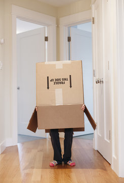 Child Playing With Box