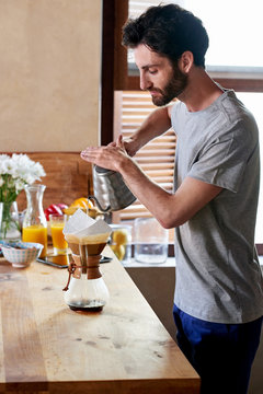 Man preparing morning coffee