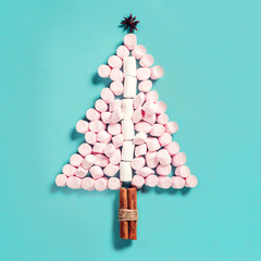 Fir tree silhouette from pink marshmallows on blue background - 177193731