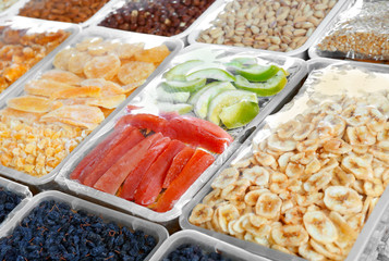 Different delicious dried fruits at market