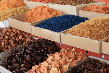 Different delicious dried fruits at market