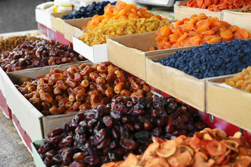 Different delicious dried fruits at market