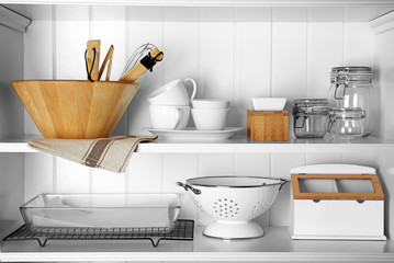 Storage stand with cooking utensils indoors