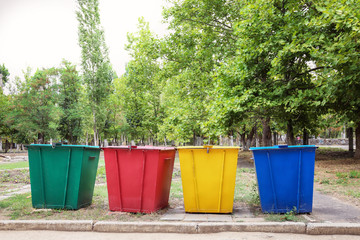Recycling bins for different types of garbage outdoors