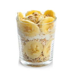 Healthy breakfast with oatmeal and fruit in glass on white background
