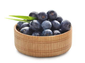 Bowl with fresh acai berries, isolated on white