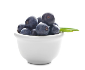 Bowl with fresh acai berries, isolated on white