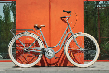 Fototapeta na wymiar Retro bicycle near wall on city street