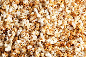 Tasty caramel popcorn as background