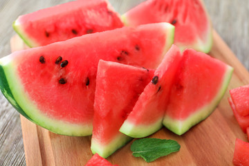 Tasty sliced watermelon on board
