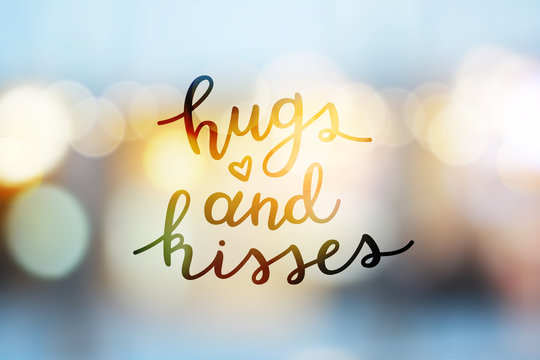 hugs and kisses, lettering, vector handwritten text on blurred lights