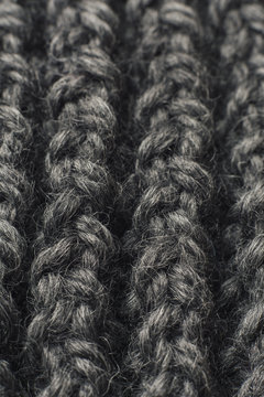 Close up detail of scarf, rows of knitted grey wool yarn