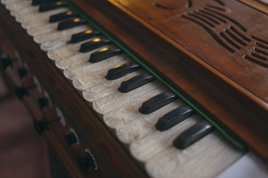 Close up of harmonium keys from above.