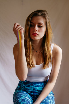 Young female model posing with rainbow stripe