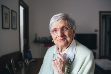 Portrait of smiling senior woman in Livingroom