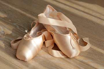 beige ballet shoes with ribbons
