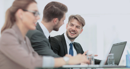 Image of business partners discussing documents and ideas at mee