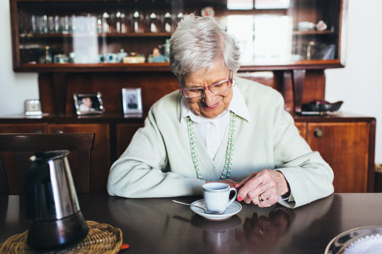 Old lady drinking a coffee