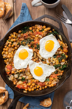 Spinach With Chickpeas And Fried Eggs