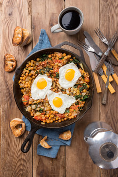 Spinach With Chickpeas And Fried Eggs