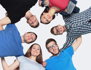 confident college students forming huddle over white background