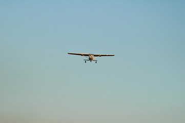 single engine plane head on for landing