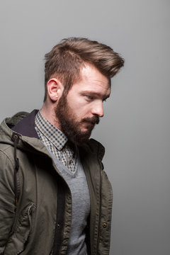 Stylish thoughtful man with a trendy hairstyle