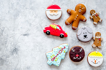 Gingerbread cookies of different shapes on stone background top view copyspace