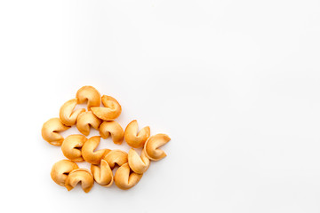 Chinese fortune cookie with prediction on white background top view mock up