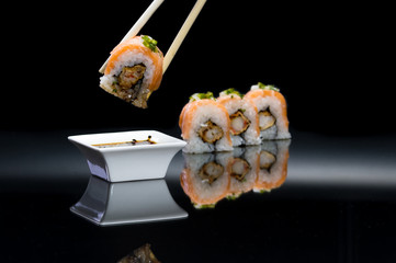 Sushi rolls over black