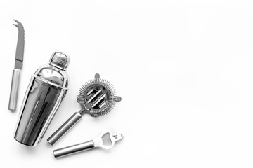 Barman equipment. Shaker, strainer on white background top view copyspace