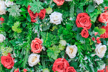 Trees and artificial flowers background.