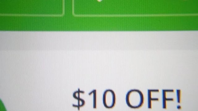 Macro of iphone screen showing Groupon