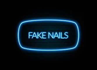 Fake Nails  - colorful Neon Sign on brickwall