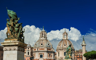 Obraz premium Twin Churches with Column of Trajan seen from Vittoriano Monument, in the historic center of Rome