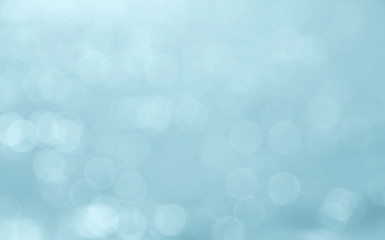 Abstract blue color blurred bokeh light / water reflection for background