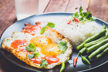 fried egg with rice.