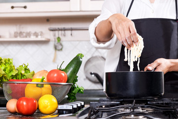 Chef Cutting cook Homemade makes dough fresh Pasta.